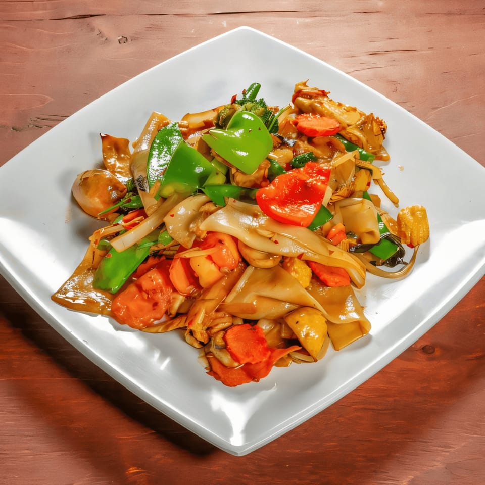 Mai Thai Restaurant's Pad See Ew with wide noodles, green peppers, carrots, and baby corn.